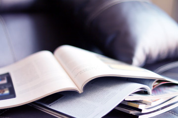 selective focus of stacking magazine place on table in living room