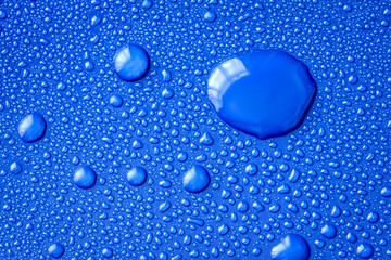 Abstract water drop on surface of  fresh blue background