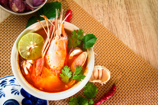 Close up Asian Spicy soup with shrimp in  bowl , famous Thai food cuisine calling Tom Yum Kung