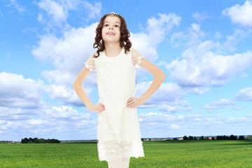 Beautiful little girl in a white dress.