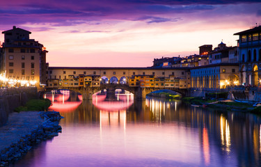 sunset above Ponte Vecchio - Old Bridge view from Arno river bank