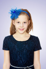 Girl with bow on her head.