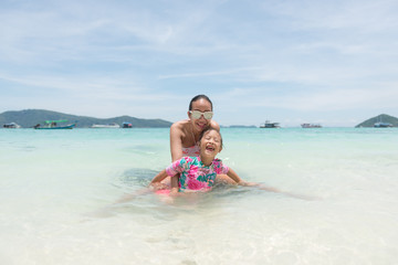 Happy loving family! Mother and child girl having fun, playing and laughing