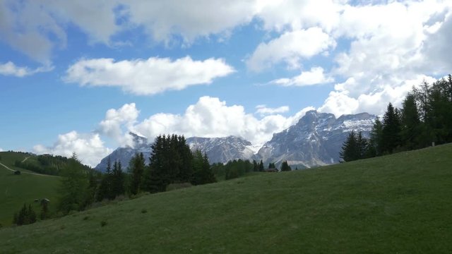 Chair lift POV near Corvara, Alta Badia, Northern Italy. Prominent Dolomites peaks include La Varella in the Cunturines subgroup of the Fanes Group.