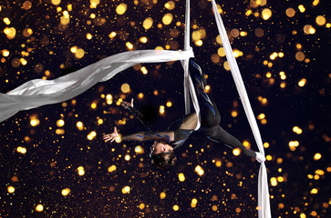 Young woman circus air gymnast © Andrey Burmakin