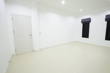 empty white room with door and window