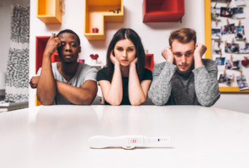 Positive pregnancy test, one woman and two man, three people, polygamy. Problem, unplanned baby,...