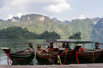 Thai boats at the pier on lake Cheo LAN
