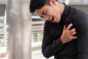 business man suffering heart attack