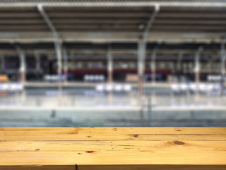 Empty wooden table space platform and blurred Train station platform background for product display montage