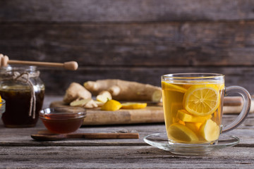  Ginger tea and ingredients on a  grunge wooden background