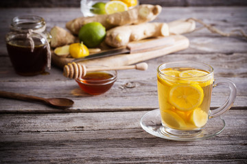  Ginger tea and ingredients on a  grunge wooden background