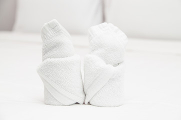 Fototapeta na wymiar Bath towels on the bed of hotel bedroom