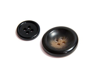 Single brown clothing button isolated over the white background