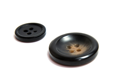 Single brown clothing button isolated over the white background