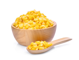 sweet corn in wooden bowl and spoon isolated on white background