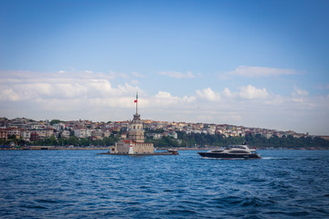 The boat approaching Maiden Tower (Kiz Kulesi) in Istanbul, Turkey.
