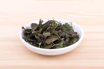 dried  ground ivy / Porcelain bowl with dried  ground ivy