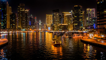 Fototapeta premium Dubai. In the summer of 2016. Beautiful night lights of ultramodern Dubai Marina on the shores of the Arabian Gulf. 