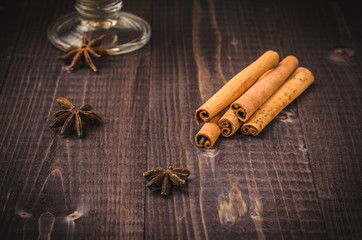 anise, cinnamon seasoning for tea on a dark table/anise, cinnamon for tea on a dark table