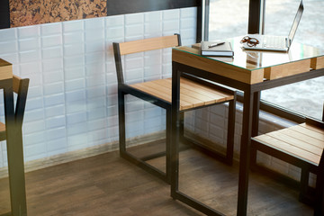 Equipment of freelance graphic designer on the table at the cafe
