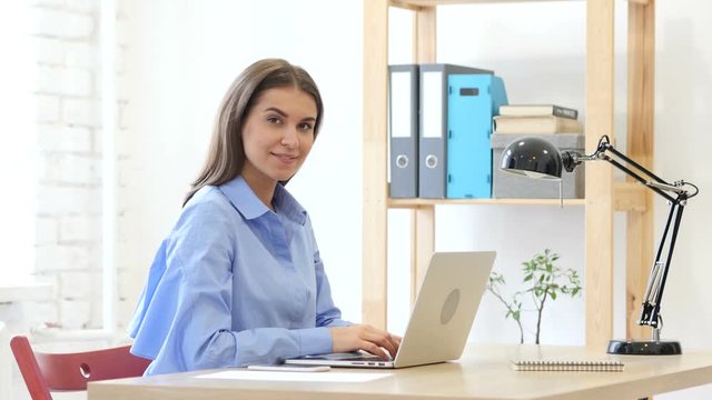 Smiling Young Woman at Work