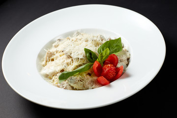 Fettuccine with chicken and mushrooms. Italian style. Italian food. Italian cuisine.