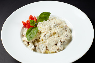 Fettuccine with chicken and mushrooms. Italian style. Italian food. Italian cuisine.