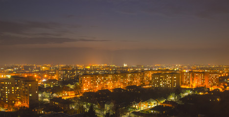 Fototapeta na wymiar Beautiful evening town panorama with the sky