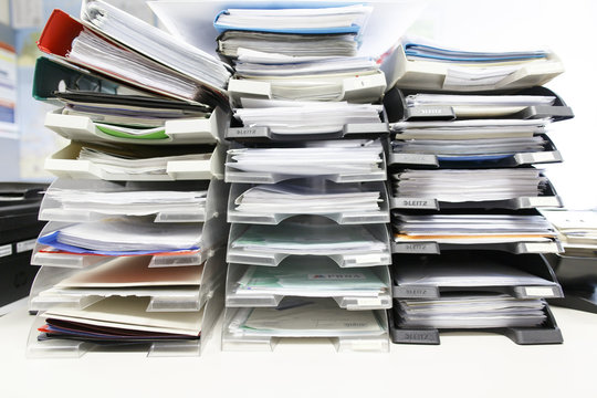 Stack of folders with document in office