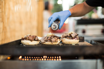 Chef cooking burgers