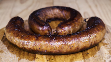 Fried Sausages On a Wooden Board