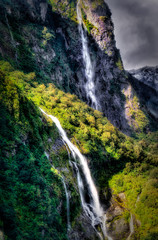 Twin Waterfalls flowing in Milford Sound