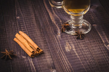 Hot mulled tea with cinnamon, orange and anise/hot tea glass with cinnamon and orange