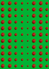 The seamless pattern of cherry berries on green background