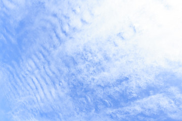 blue sky background with tiny clouds