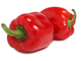 Red tomatoes and peppers on white background