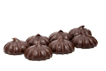 Pile of marshmallows glazed with chocolate. Many coated elegant zephyr dessert isolated on white. Sweet elegant dessert on a plate