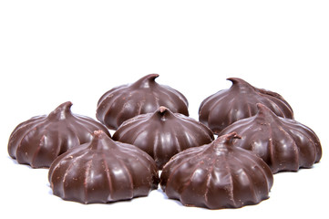 Pile of marshmallows glazed with chocolate. Many coated elegant zephyr dessert isolated on white. Sweet elegant dessert on a plate