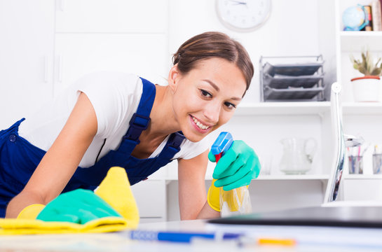 woman cleaning in company office