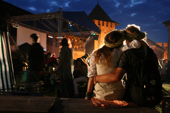 Young couple relaxing at an open-air music festival
