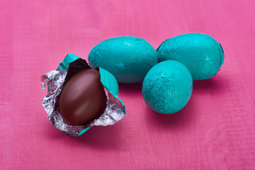 Chocolate eggs on a wooden background
