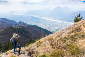 Hiker looking from Monte Chiampon to Friuli-Venezia Giulia