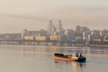 Naklejka premium Ship sailing on the river in the morning at dawn I
