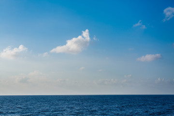 Landscape view of the blue sea blue sky with white clouds