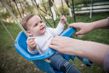 Cute smiling little girl on swing
