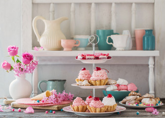 pink cakes on plate on white background