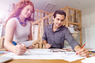 Two young architects in office