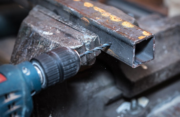 Worker drills a hole