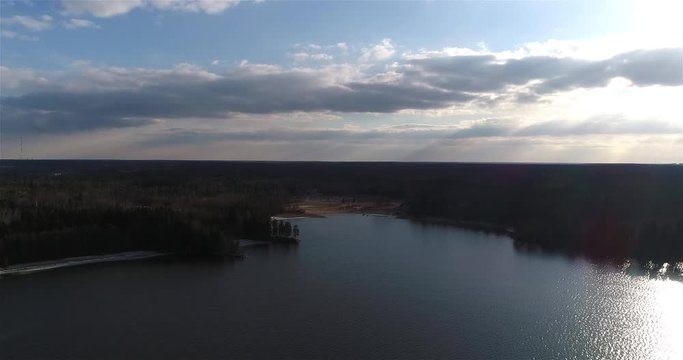 Oittaa, Cinema 4k aerial flight towards Oittaa, at bodom lake, on a sunny spring day, in Espoo, Finland